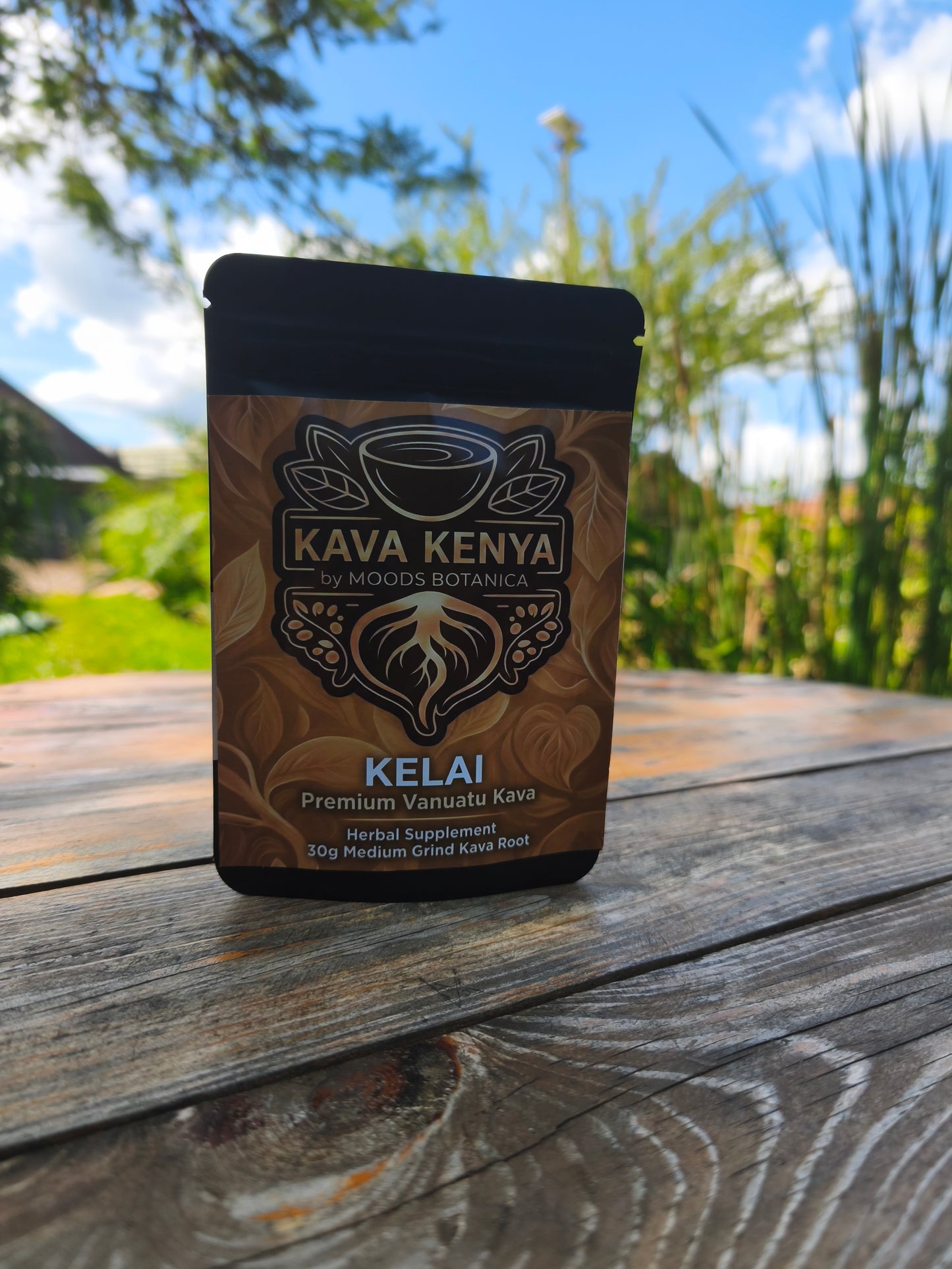 Kava Kenya Kelai package on a wooden surface with a blurred natural background