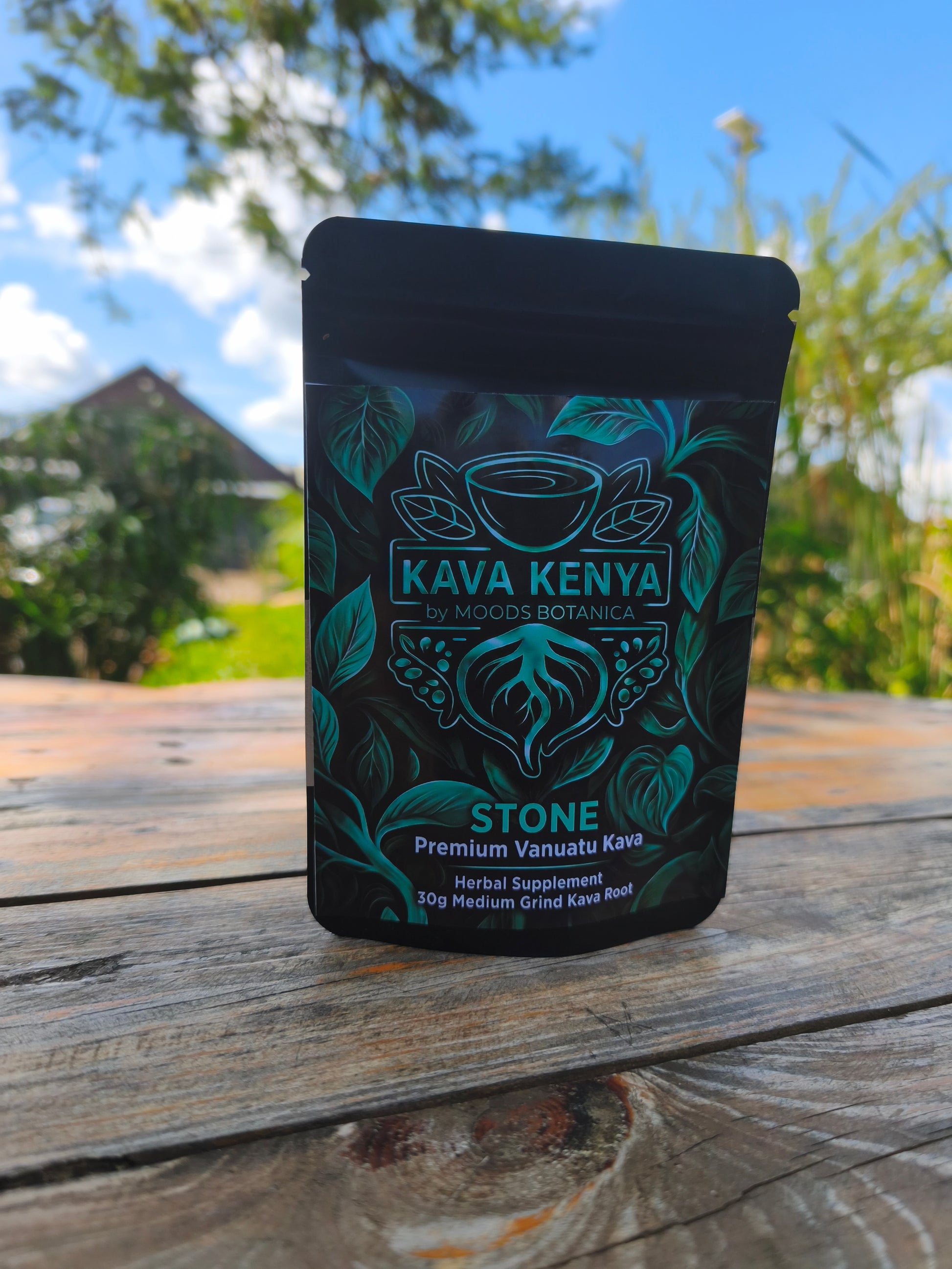 Kava Kenya Stone packaging on a wooden surface with a natural background